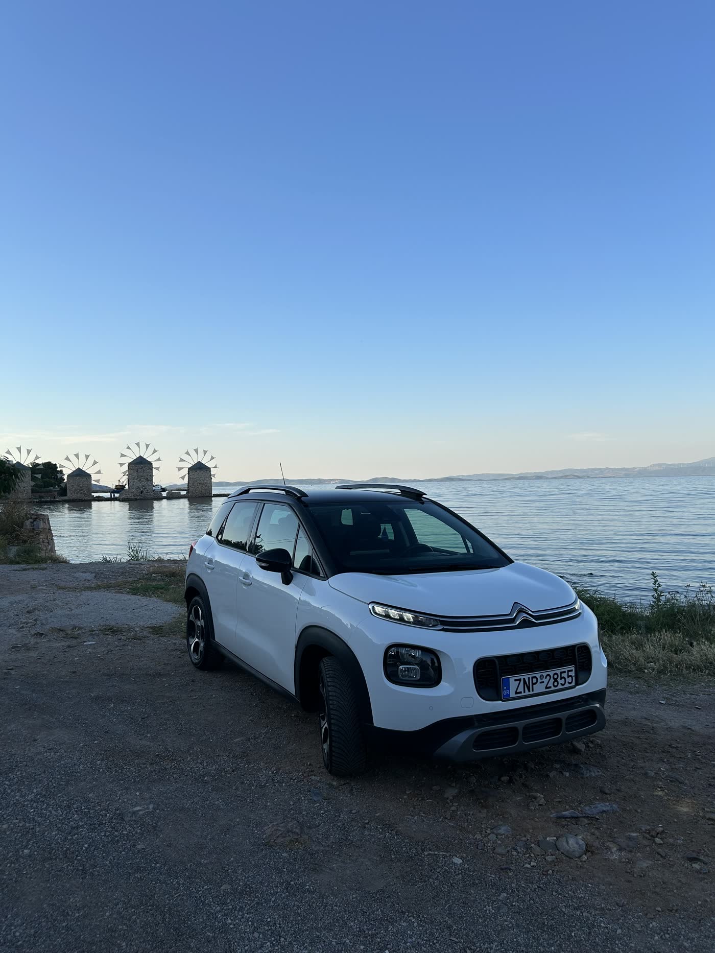 White Citroën C3 Aircross by the Tampakika windmills, Chios