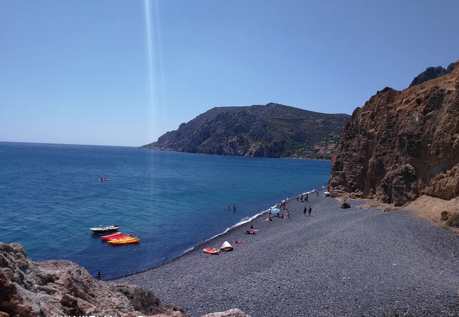 The black volcanic pebbles of Mavra Volia beach, Chios
